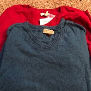 Two men’s sweaters
